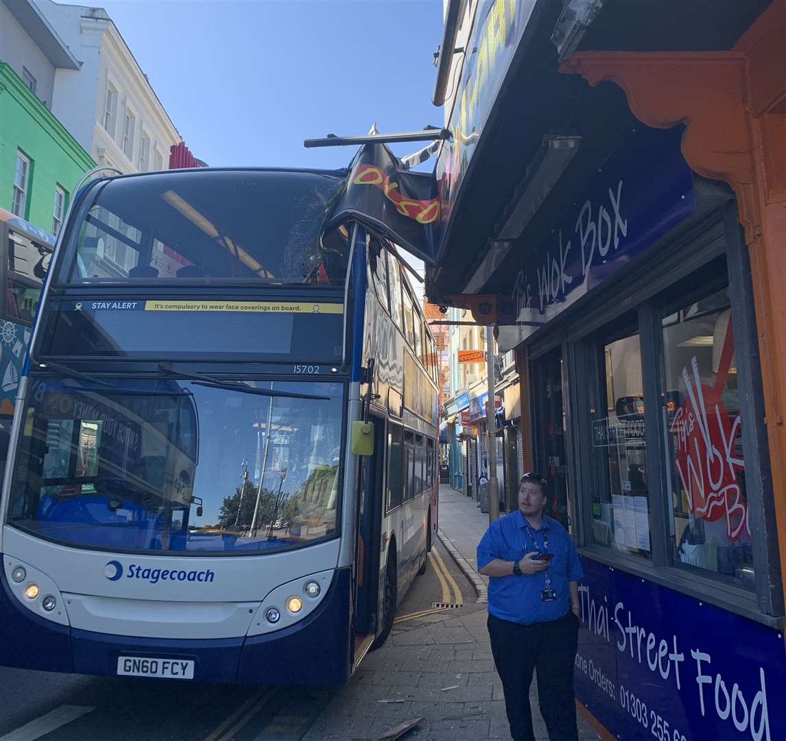 The bus and sign were still attached until bar owner Keith Craig climbed up and cut the sign off. Picture: Keith Craig