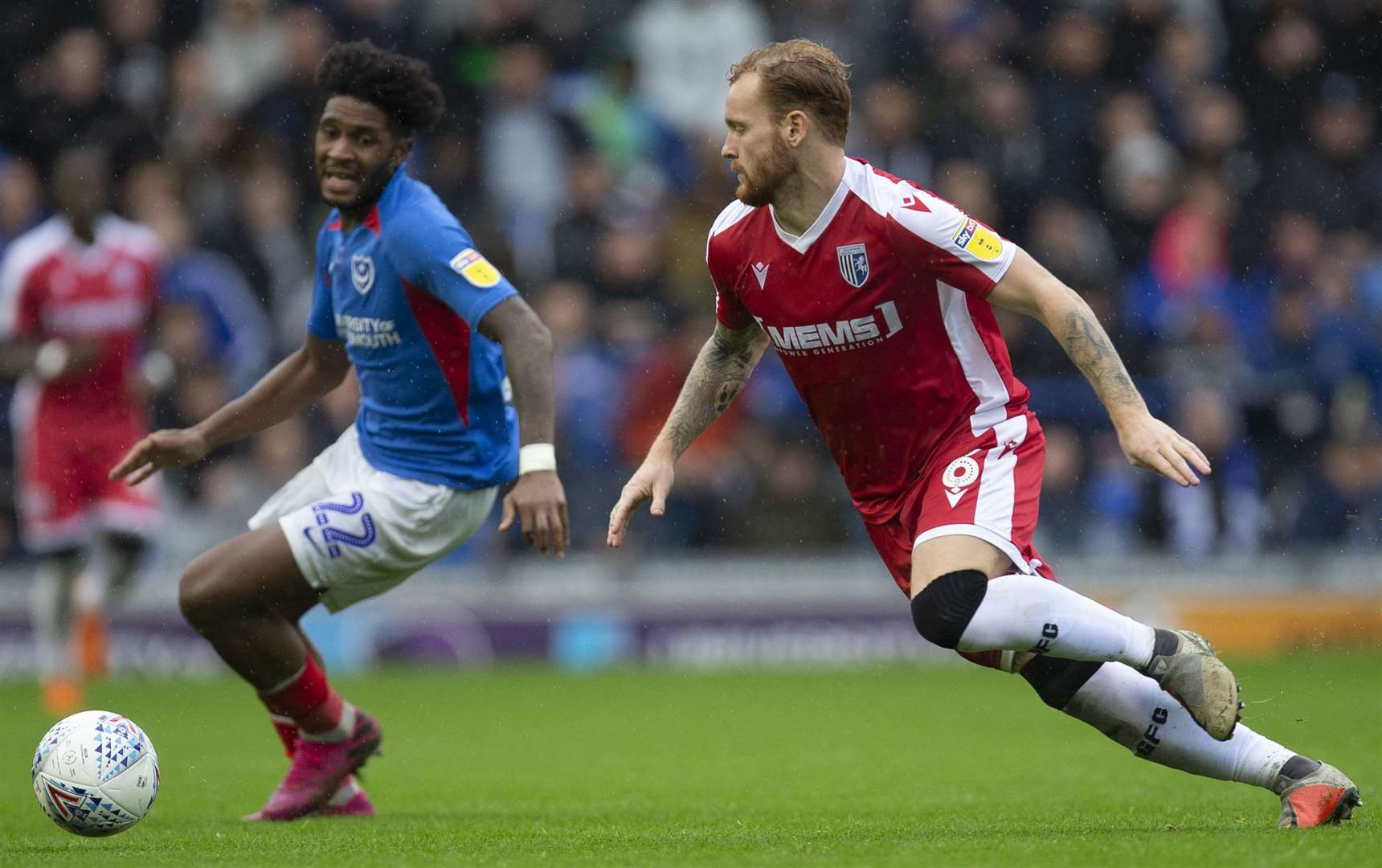 Connor Ogilvie closes down Pompey's Ellis Harrison Picture: @KentProImages