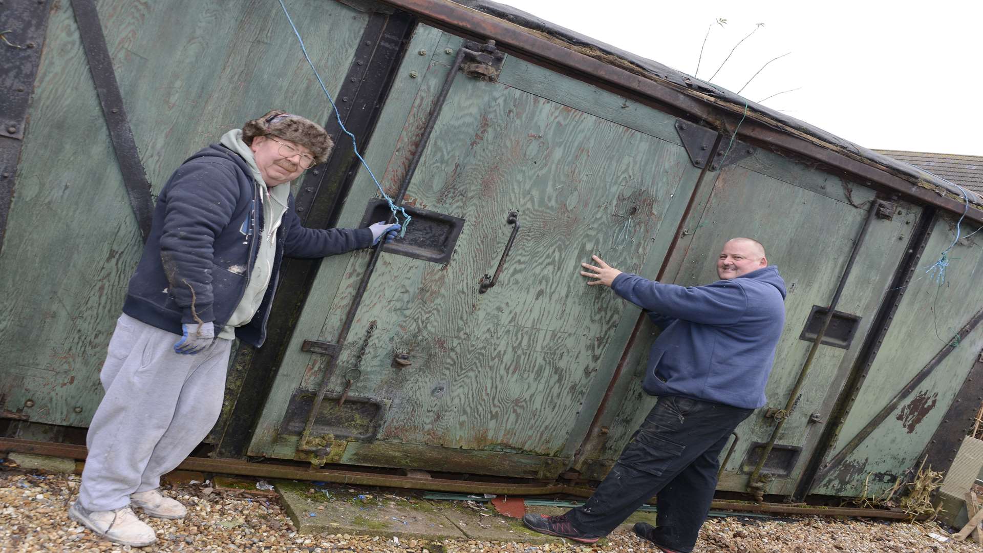 The disused railway carriage is in a garden