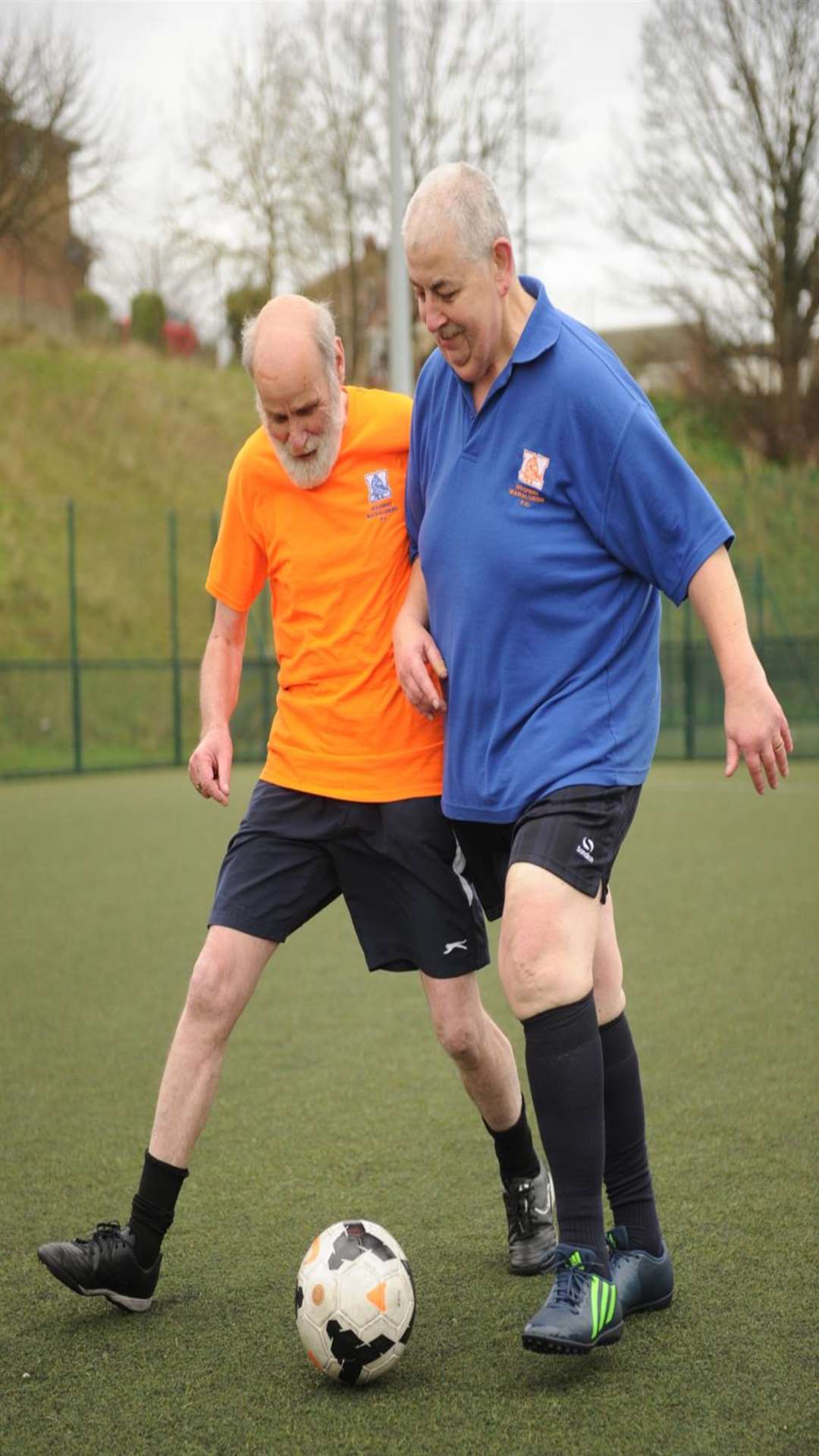 Les Rough (left) and Chris Pocock compete for the ball