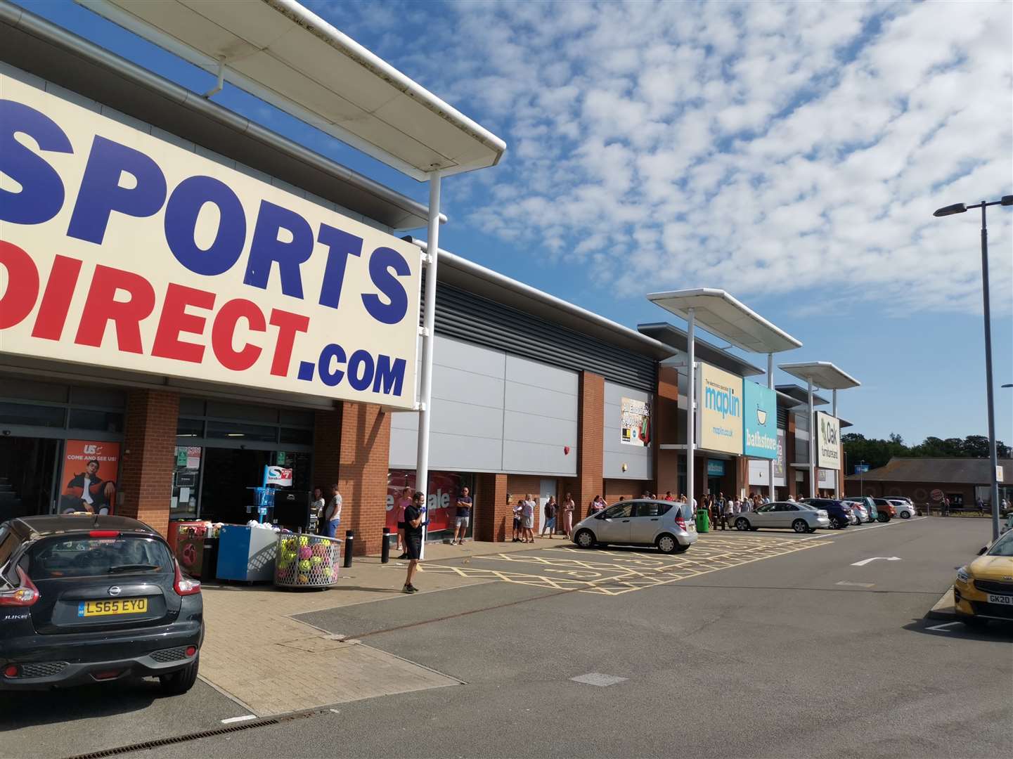 Shoppers outside Westwood Cross' Sports Direct