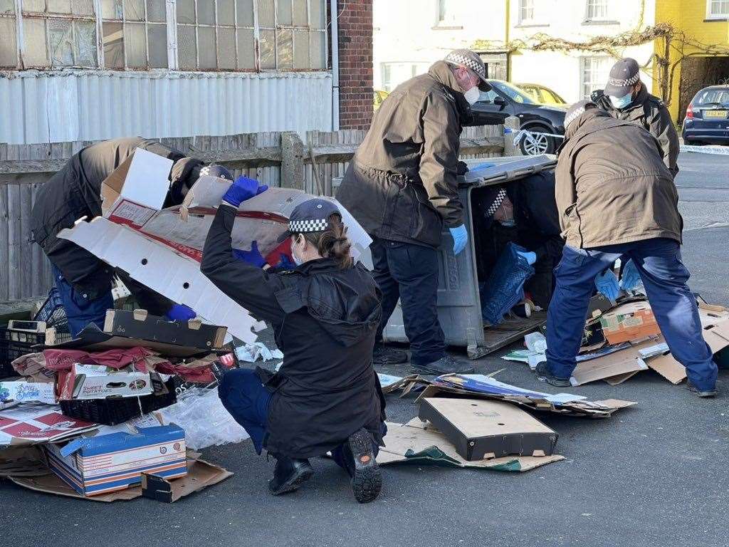 Police search through rubbish in Sandwich. Picture: UKNIP