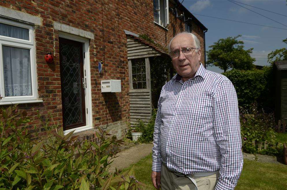 Colin Samson in the front garden of his home