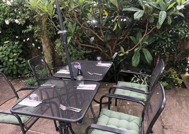 Tables in the garden, as well as the pub, were laid for dining