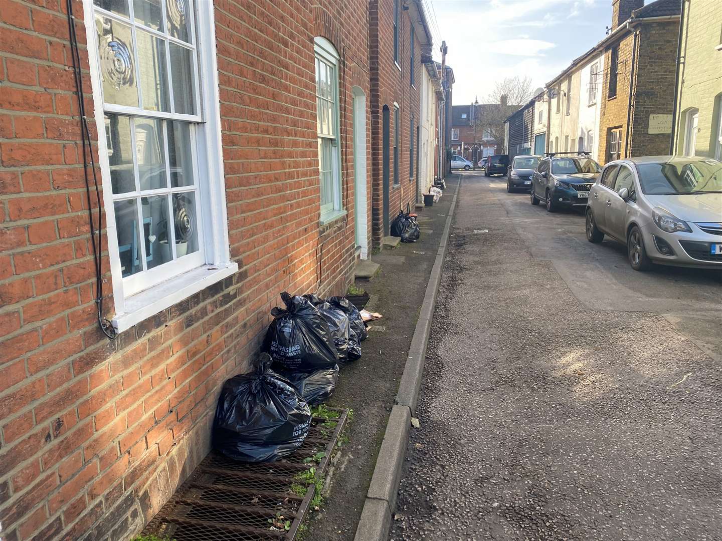 Nelson Street now has multiple items waiting for collection lying in the road with nowhere else to go