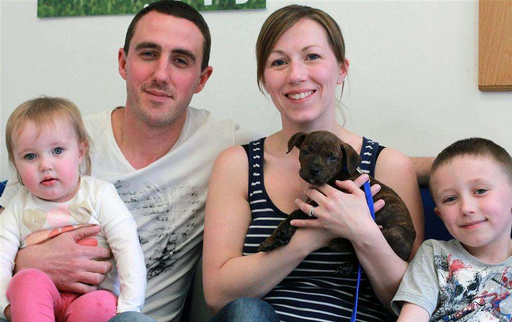 Daniel Seymour, his wife Rachael with children Emilia and Oliver. They're pictured with their Staffordshire cross, Marley.