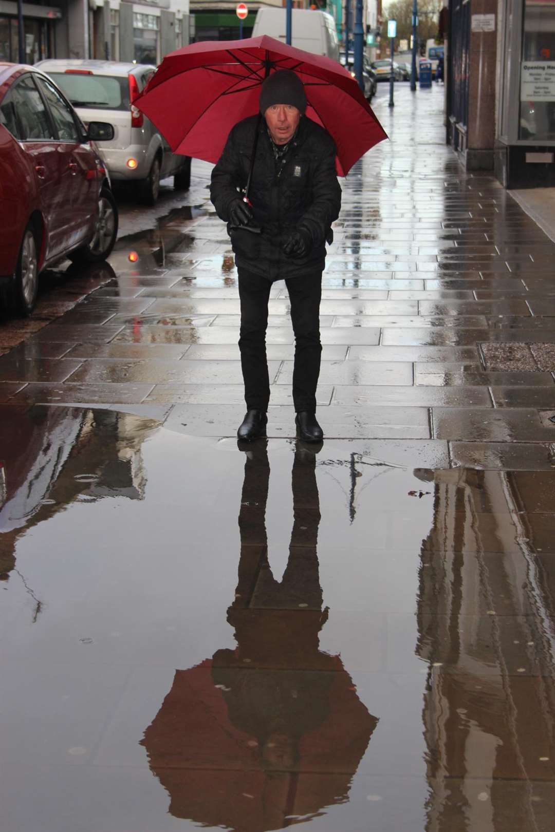 Impassable: William Crawford comes to a halt at the giant puddle in Sheerness High Street (5882844)