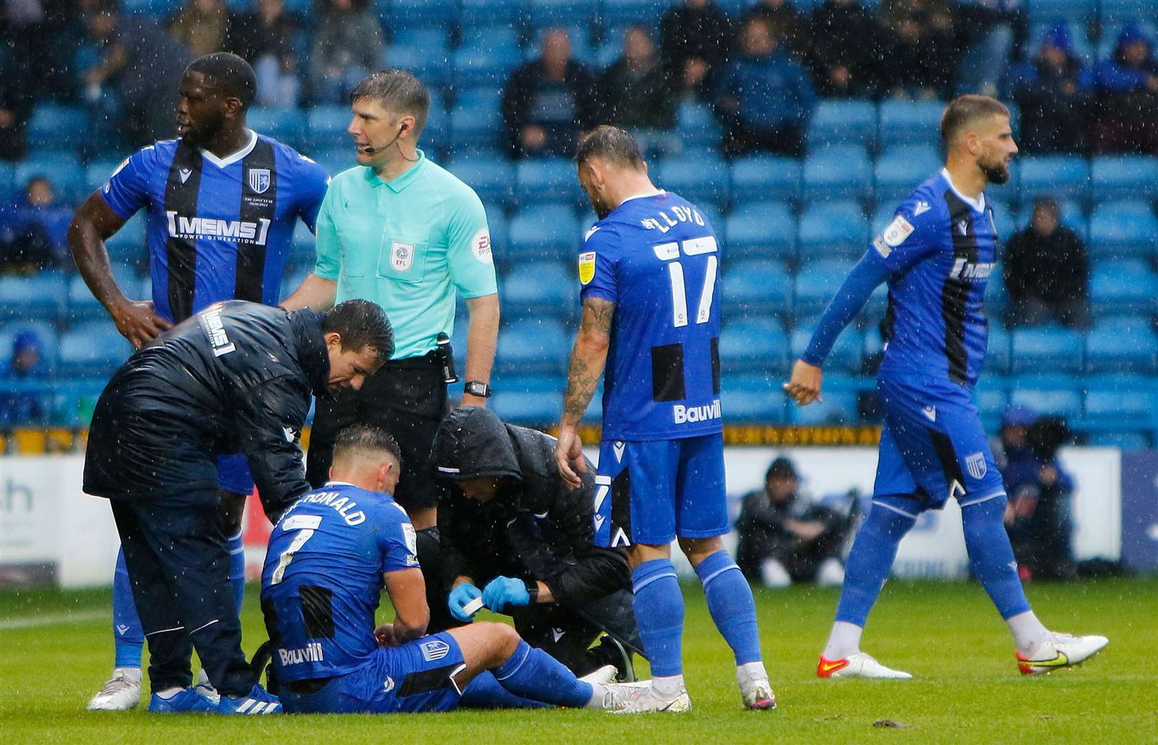 Gillingham midfielder Alex MacDonald needs treatment. Picture: Andy Jones