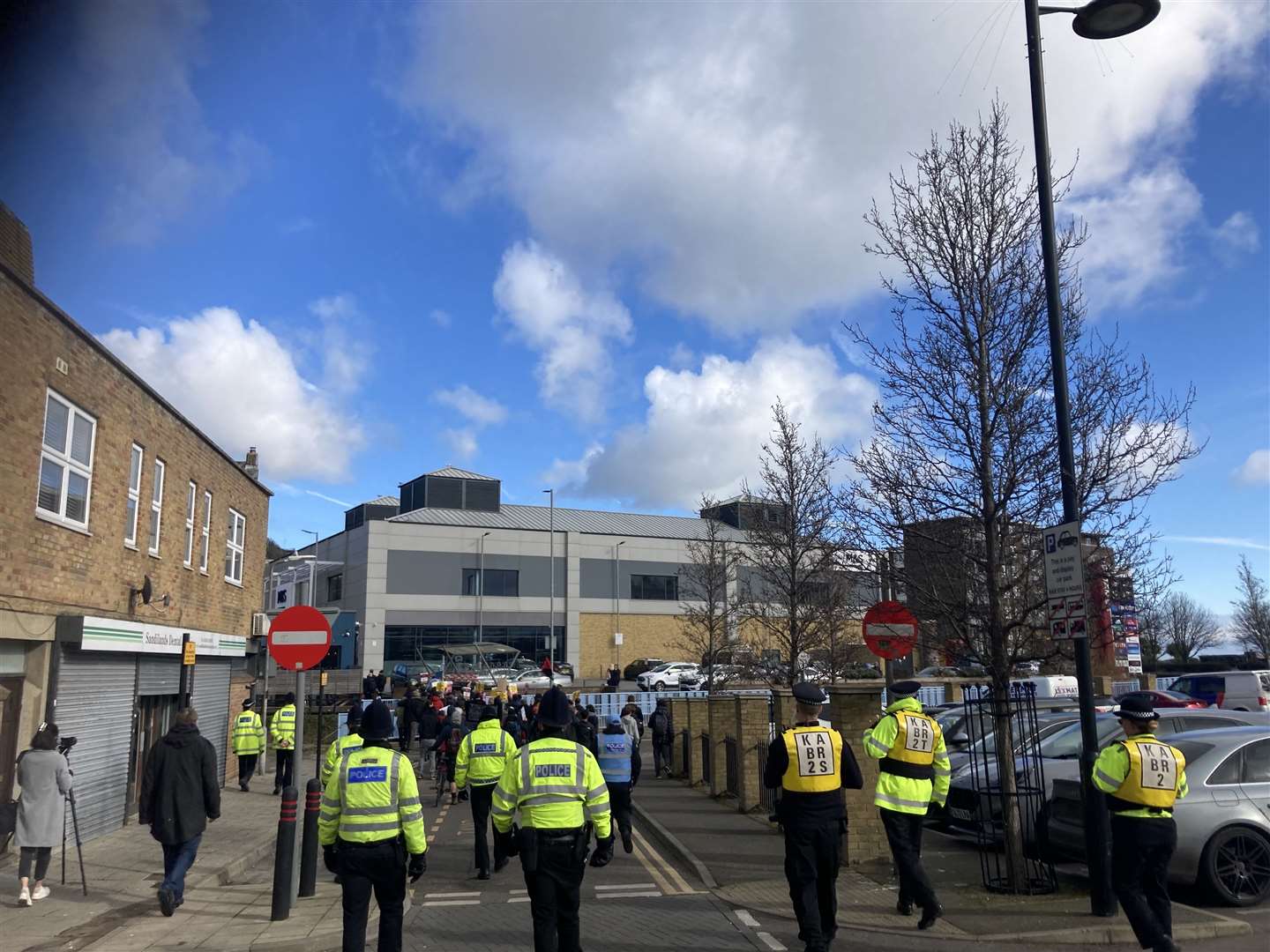 Police with anti-fascist protesters, heading towards St James' in Dover