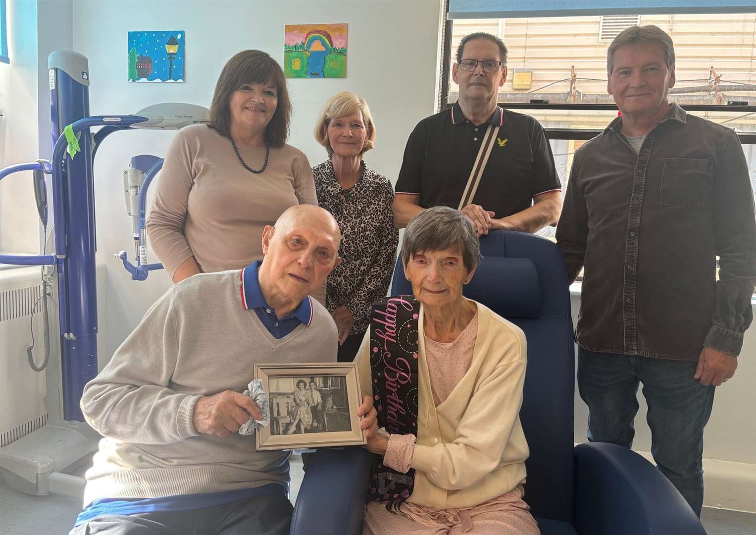 John and Elizabeth were thrilled to be reunited - pictured here with four of their five children. Picture: NHS