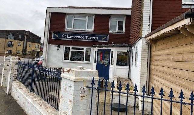 The entrance to the pub sits at the corner of the building, which you reach by walking through a small slabbed area behind blue railings