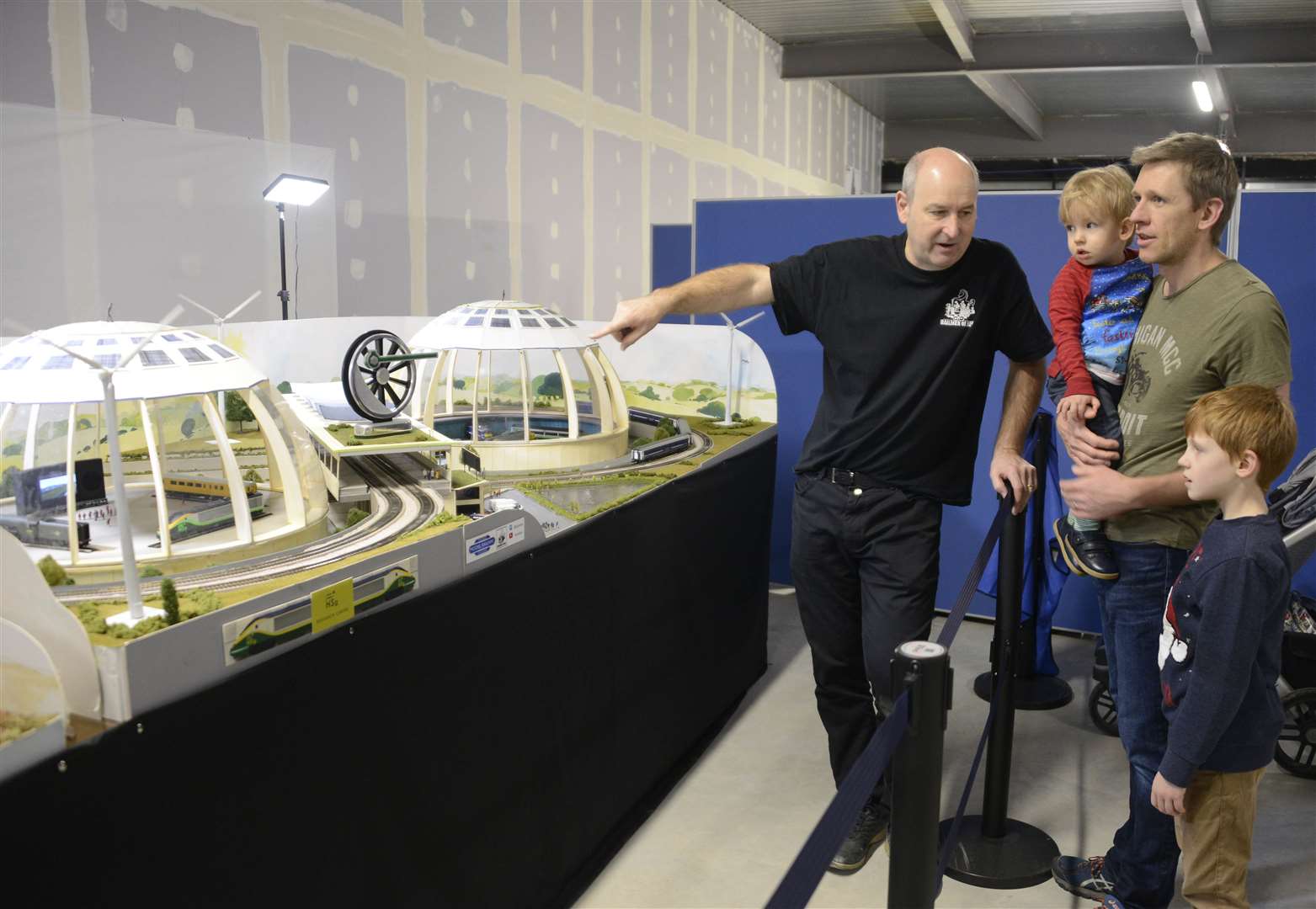 Fred Garner showing a layout to Ben Jones and his sons Luca and Zac at Elwick Place. Picture: Paul Amos