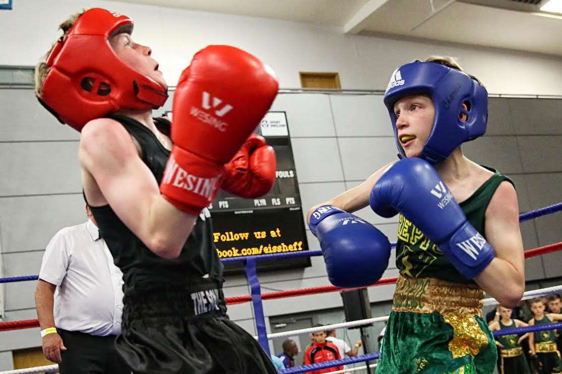 Champion Charlie Hickford, right, who triumphed in the final of the Class A 31kg category