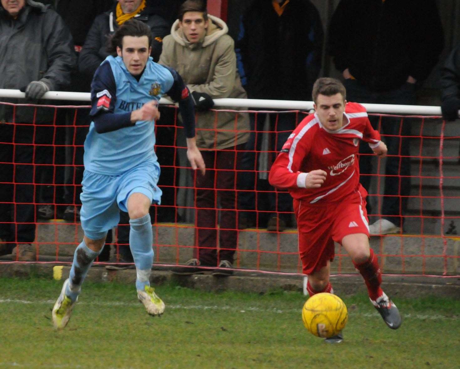 Kane Rice, joint-manager of Maidstone's new development squad, is tracked by Tom Mills playing for Hythe against the Stones Picture: Steve Terrell