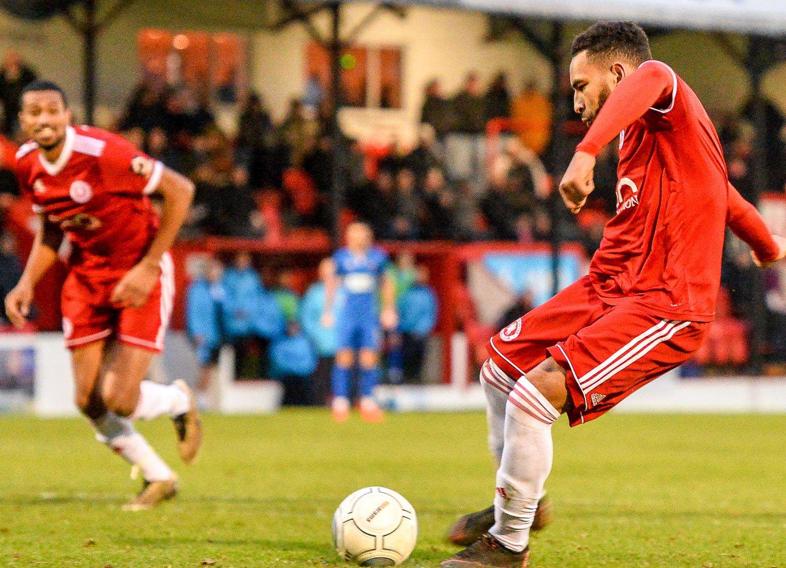 Brendan Kiernan scores from the penalty spot against Eastbourne. Picture: Dave Budden