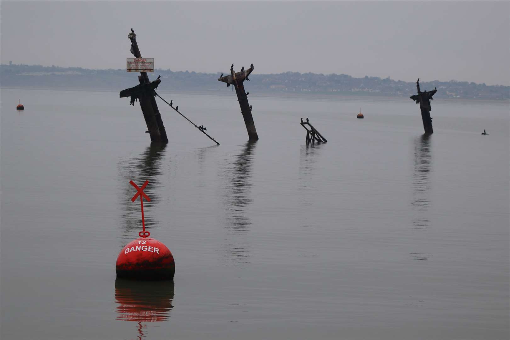 Last chance to see the masts of the Sheppey bomb ship the SS Richard Montgomery sunk during the Second World War before they are cut down on the orders of the Ministry of Defence