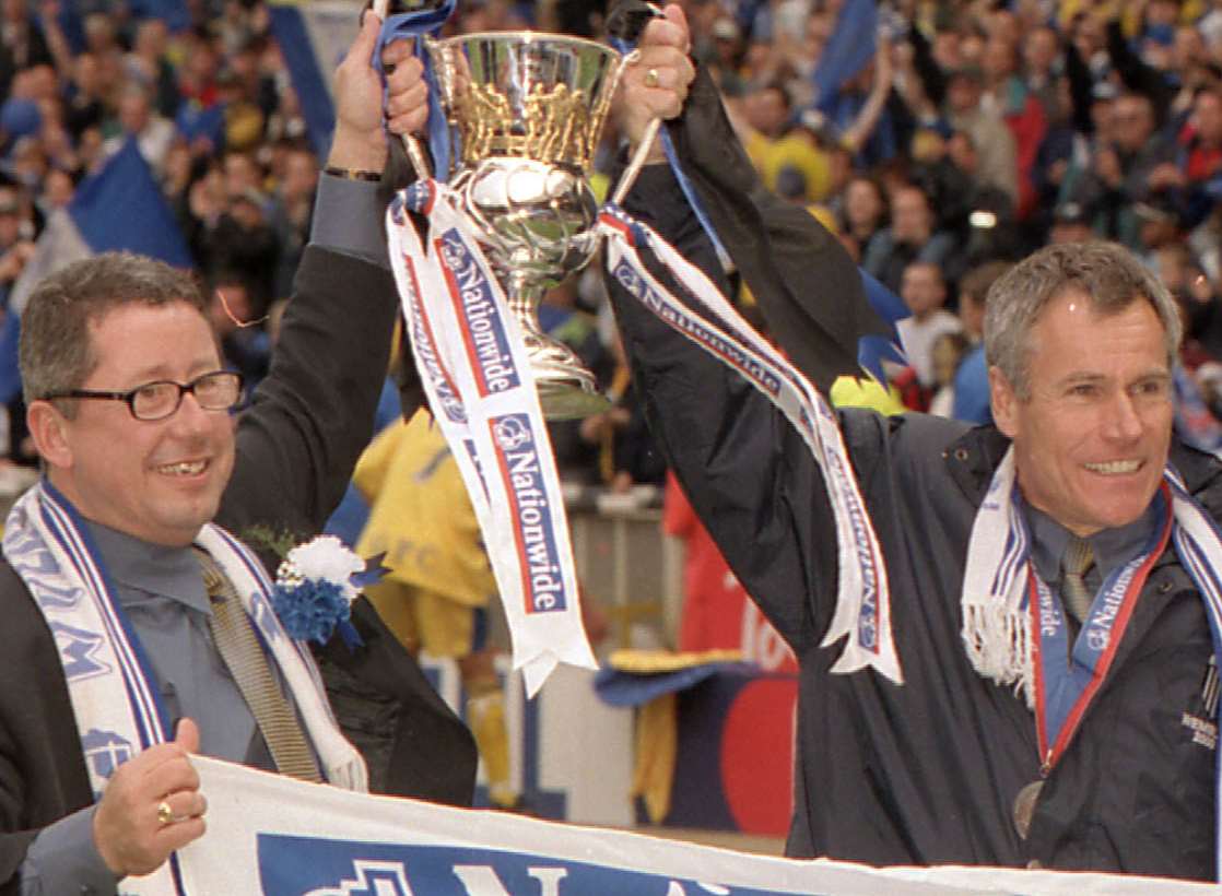 Gills chairman Paul Scally and then-boss Peter Taylor celebrate promotion at Wembley in 2000