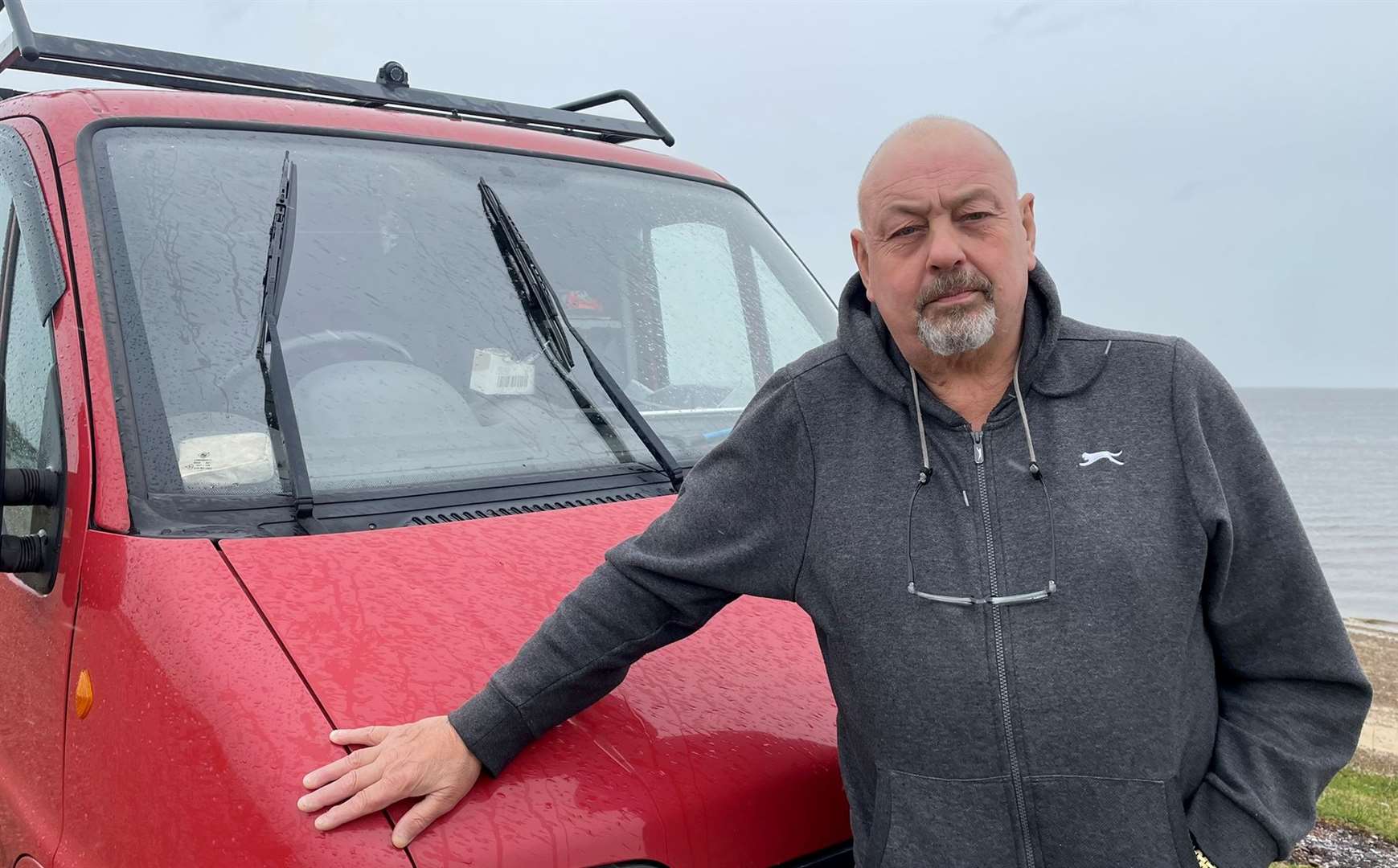 Jim Smart, from Sheerness, parks up on the Shingle Bank beach in Minster to sit by the sea and play his piano. Picture: Joe Crossley