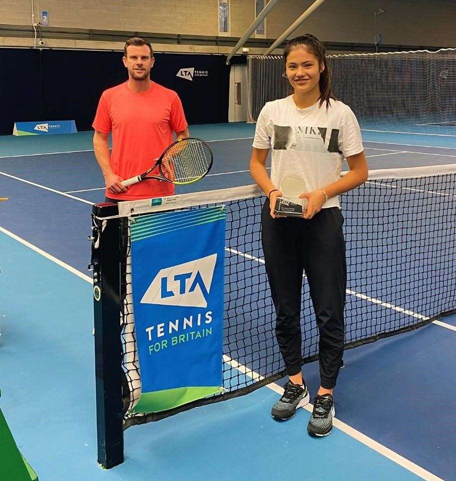 Emma Raducanu belatedly receives her LTA girls' player of the year award from GB Davis Cup captain Leon Smith at the National Tennis Centre