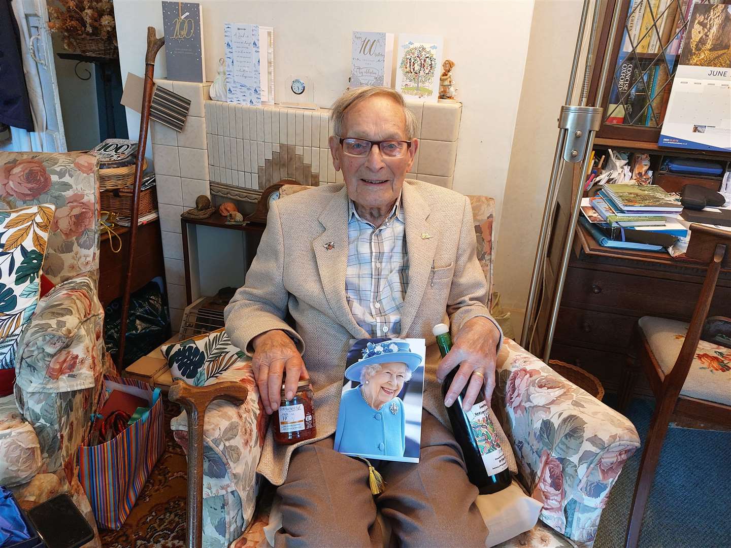 Hernhill resident John Sim pictured with his letter from the Queen and some of his homemade wine and jam