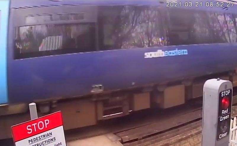 The moment a train narrowly misses four reckless cyclists crossing on a red light at the Pebble Street level crossing near Rochester. Picture: Network Rail