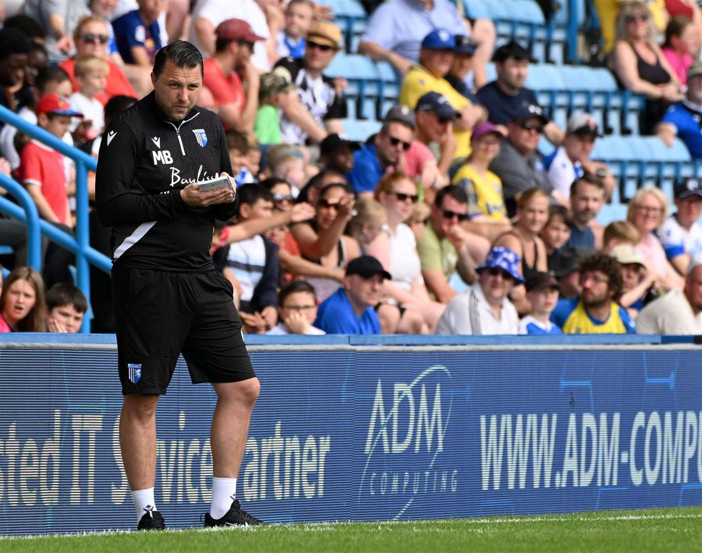 Gillingham manager Mark Bonner watching on against Watford Picture: Barry Goodwin