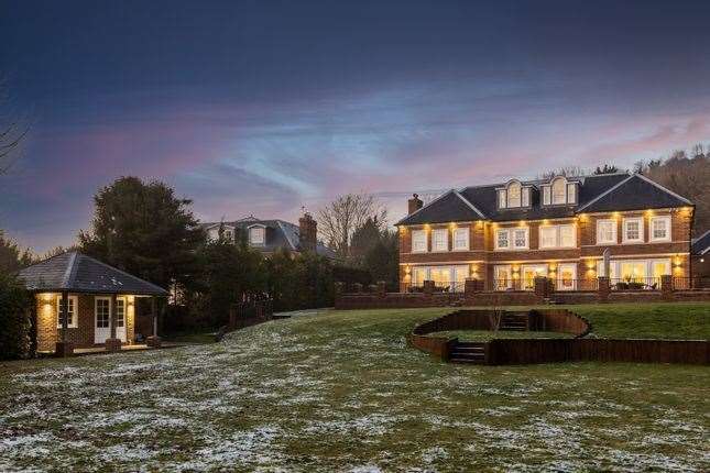 The rear lawn and summerhouse. Picture: Zoopla / Maison