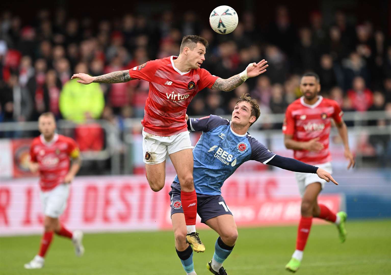 Ebbsfleet's Craig Tanner wins a header in midfield against Fleetwood. Picture: Keith Gillard