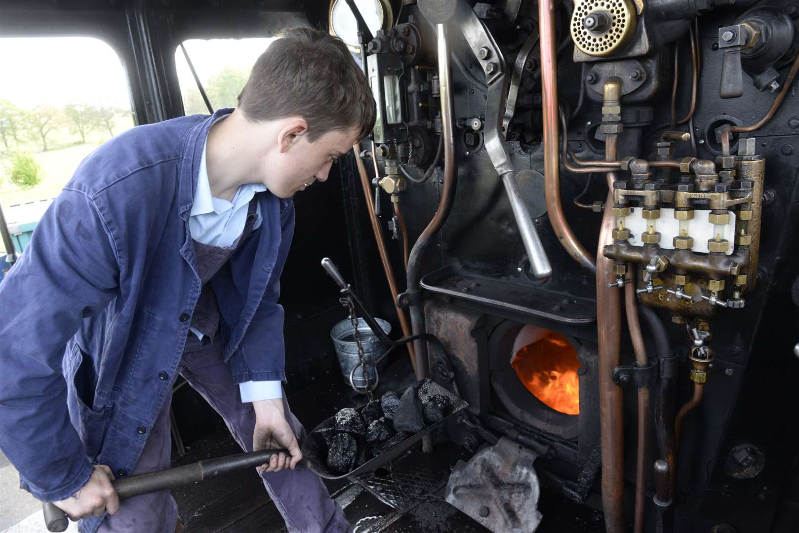 Fireman George Harman onboard Foxcote Manor at the Kent & East Sussex Railway Picture: Chris Davey/KESR FM4762139