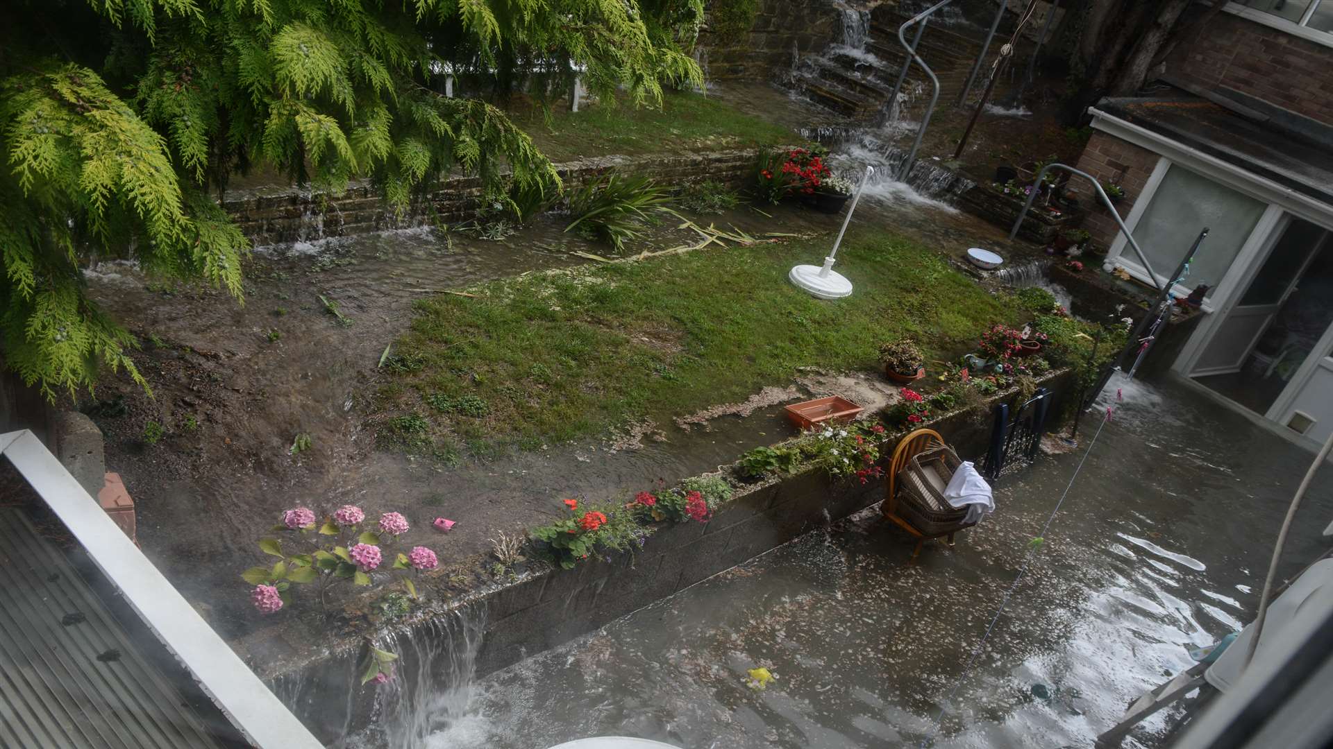 A flooded garden. Credit: Jackie Andrews and Patrick Fowler in Downs Road