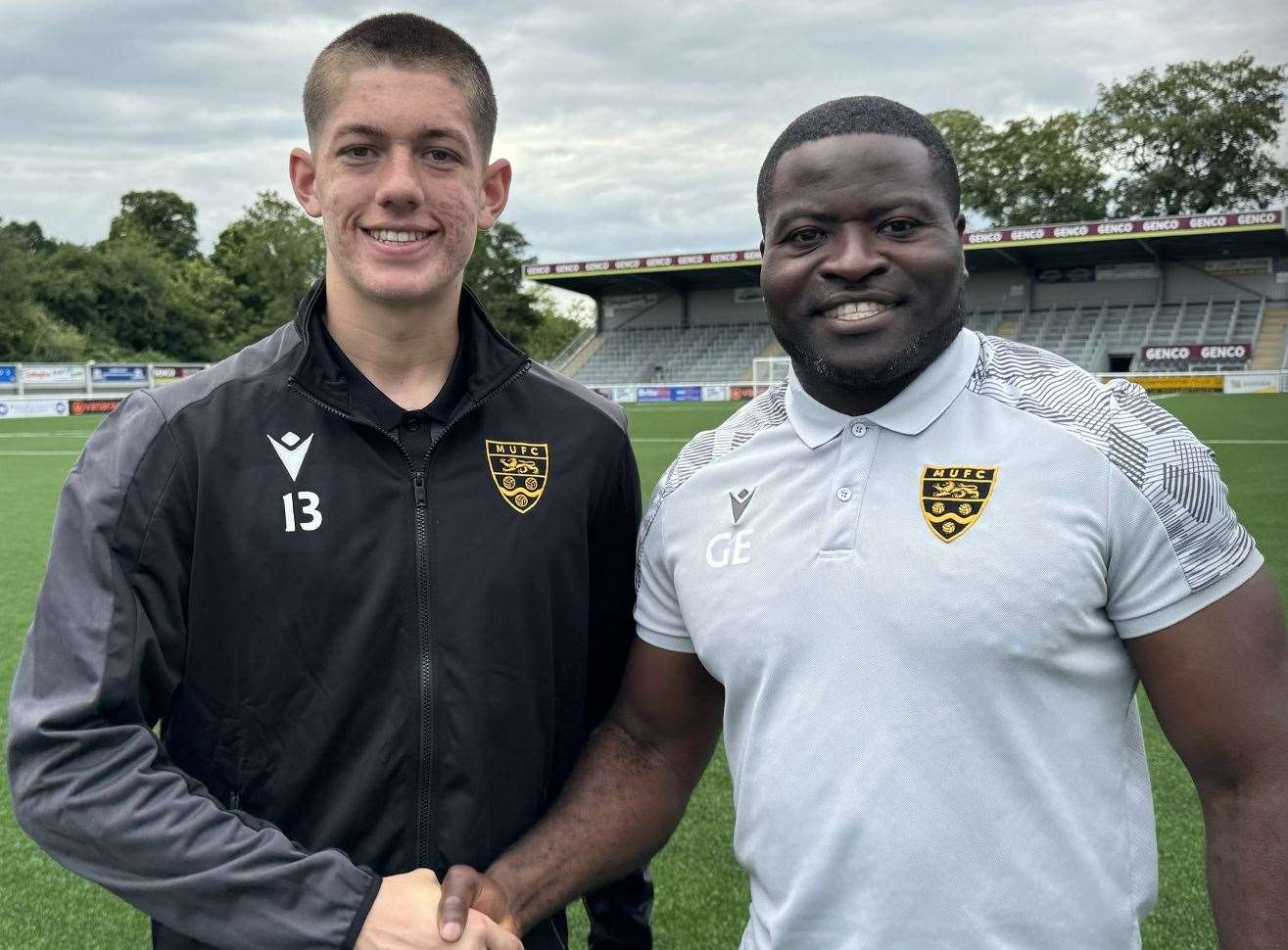 Lenny Holden is welcomed to the Gallagher by Maidstone boss George Elokobi. Picture: MUFC