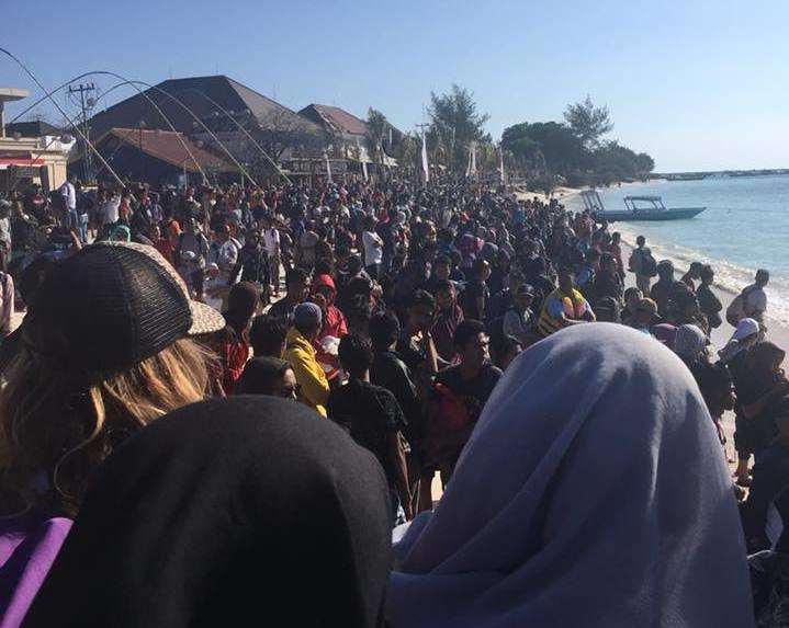 People on the beach trying to escape the island. Picture: Vicky Marchant