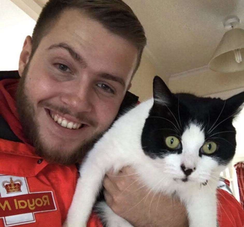 Matt with his black and white cat Bow