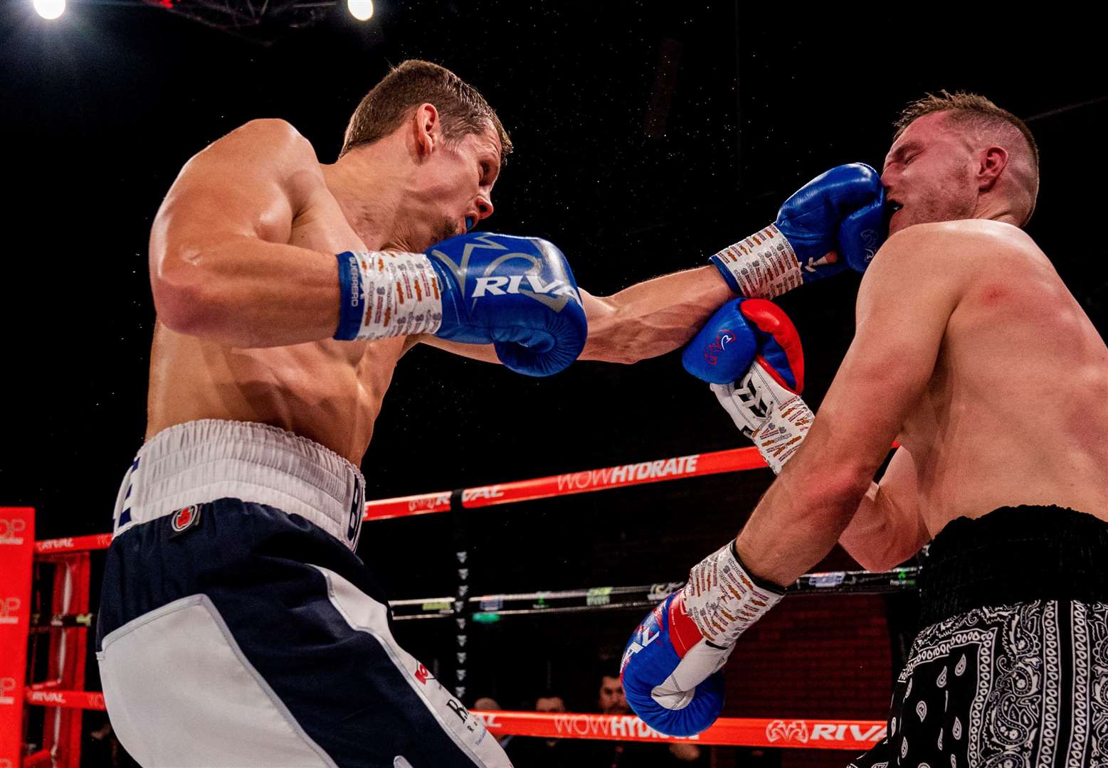 Faversham’s Alex Branson-Cole connects against Jordan Latimer on his way to victory on Saturday night. Picture: Charlie Gerrard