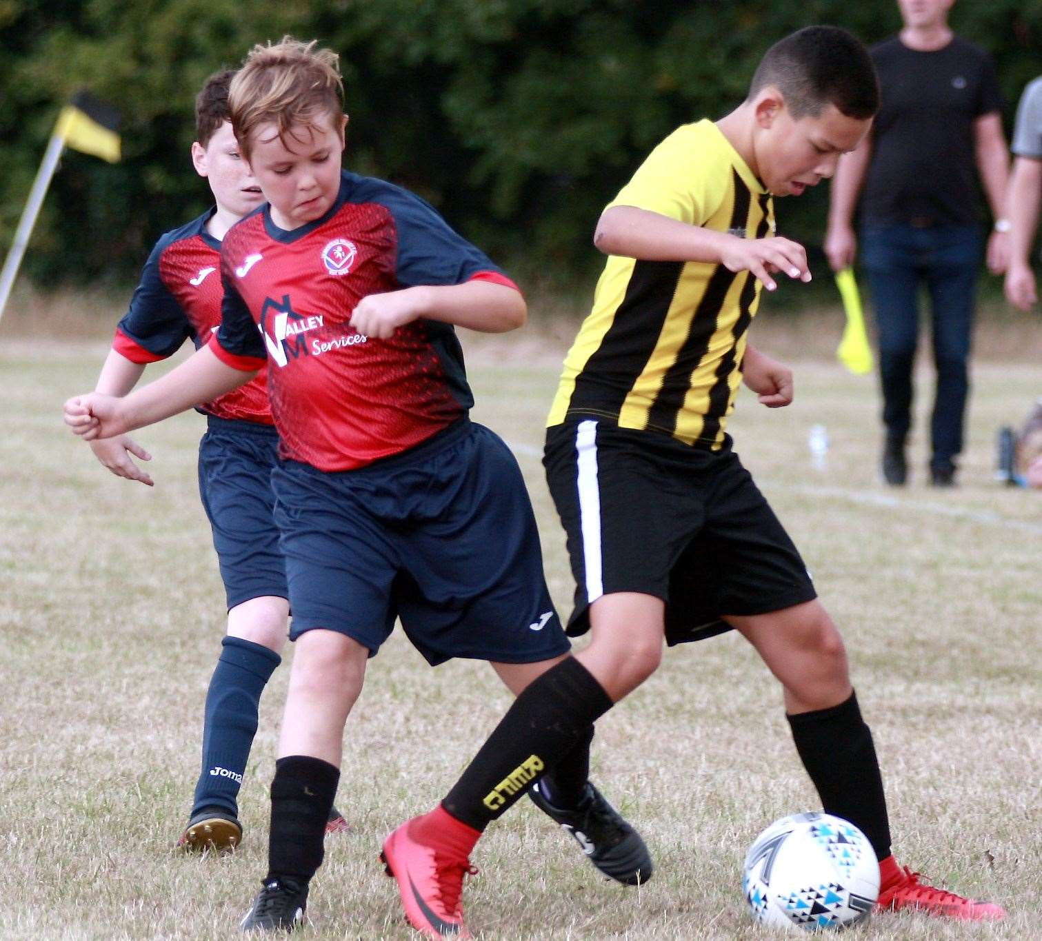 Rainham Eagles under-11s (yellow/black) and Hempstead Valley under-11s get stuck in Picture: Phil Lee