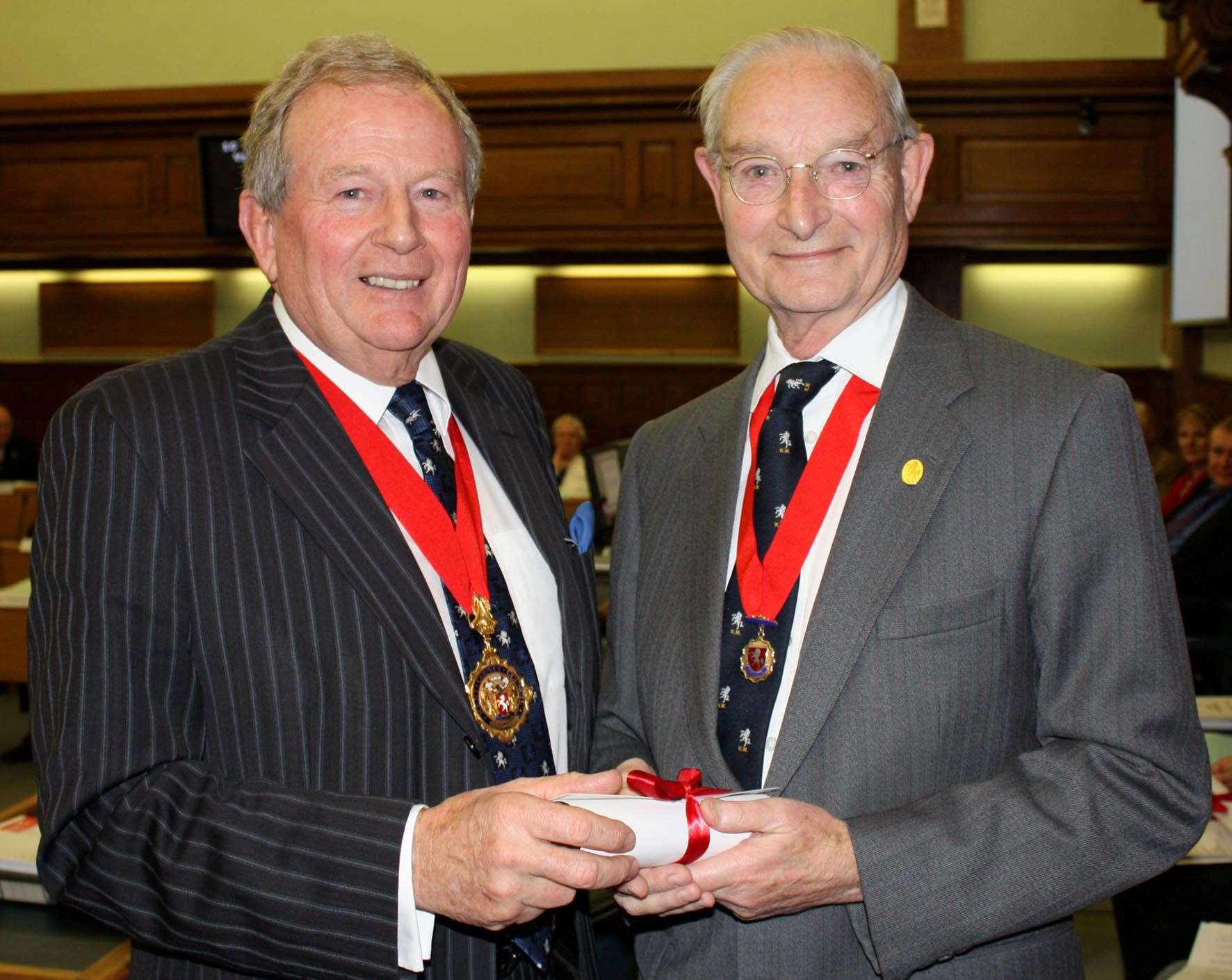 Chairman John Davies pictured with Peter, who was given the title of Honorary Alderman in recognition of his service to the council. Picture: KCC/Ian Tucker