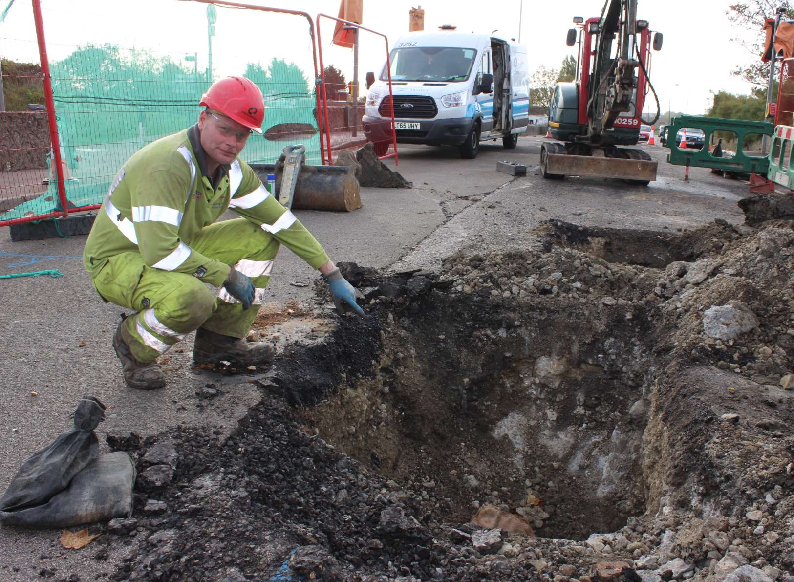 Engineer Ben Jeffery studies the damaged water main.