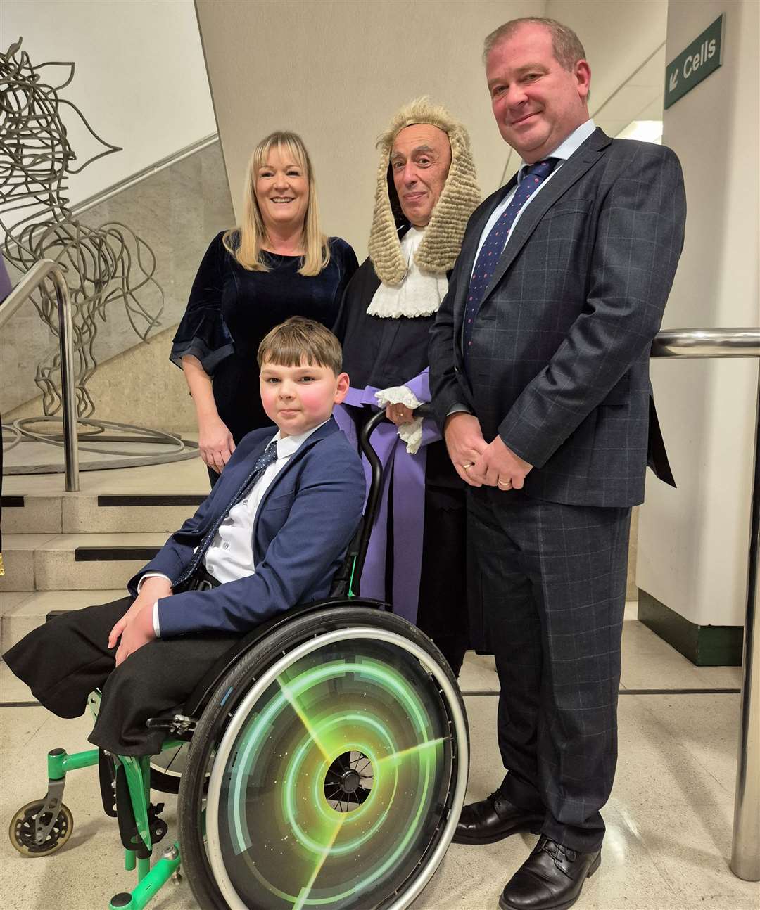 Judge Philip Statman with Tony Hudgell and his parents, Paula and Mark Hudgell. Picture: Julia Roberts