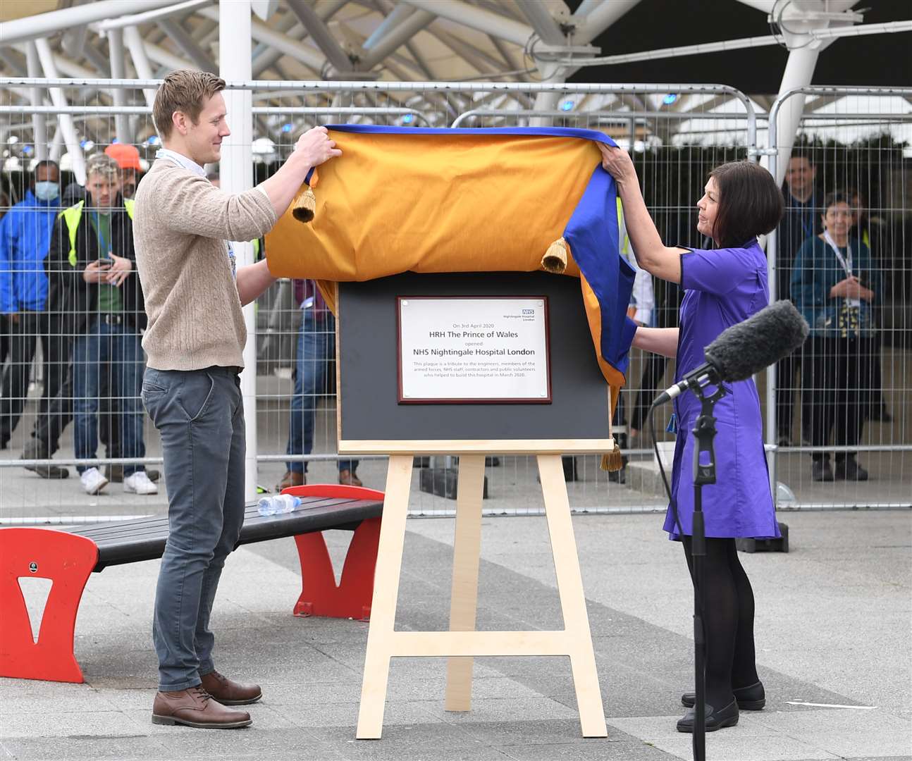 Natalie Grey, head of nursing at NHS Nightingale hospital, unveils a plaque on behalf of the Prince of Wales at the opening of the new facility (Stefan Rousseau/PA)