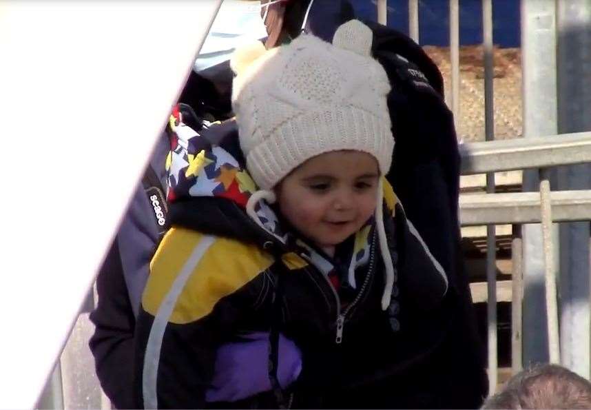 A baby is lifted from a small boat at Dover Picture: Chris Johnson