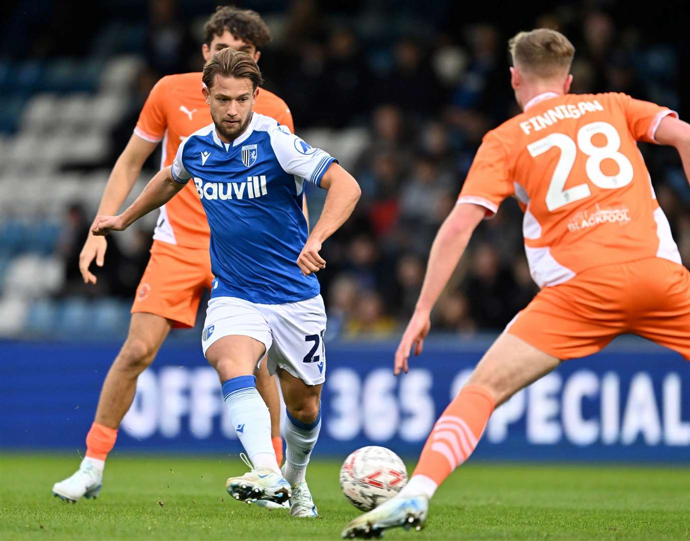 Euan Williams on the ball in midfield for Gillingham against Blackpool on Saturday. Picture: Keith Gillard