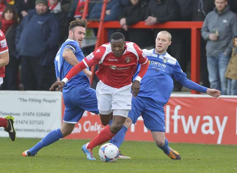 Anthony Cook skips past two Bishop's Stortford players Picture: Andy Payton