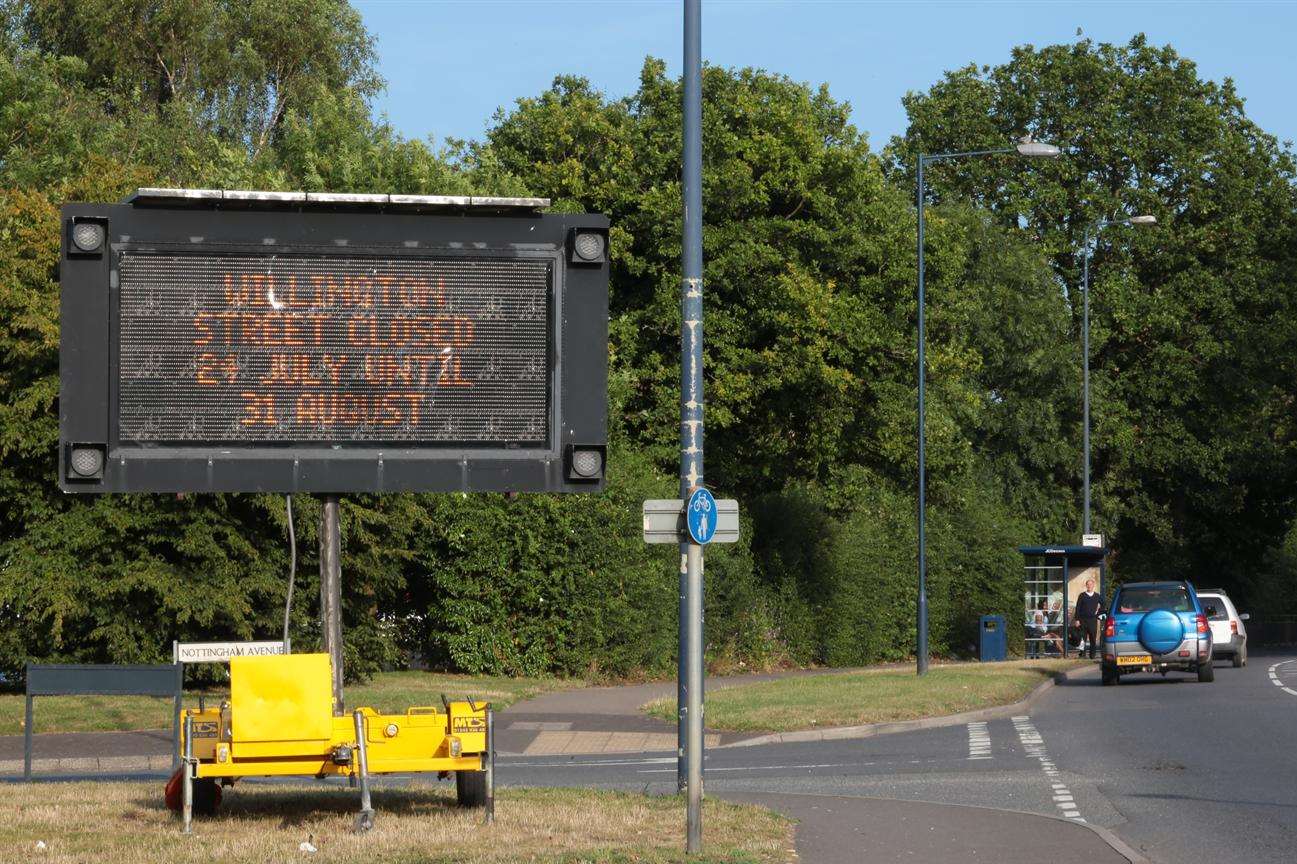 Signs warn drivers of the road closure.