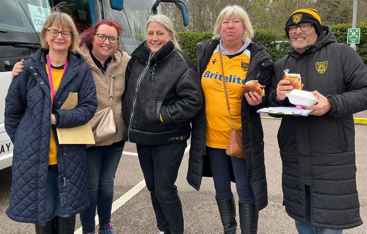 A quick bite to eat before boarding the coaches in Maidstone. Picture: Lorraine Humm