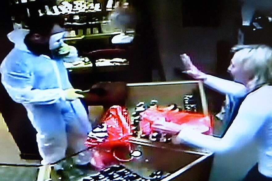 One of the raiders was caught on camera inside Andrew Smith Jewellers in West Malling