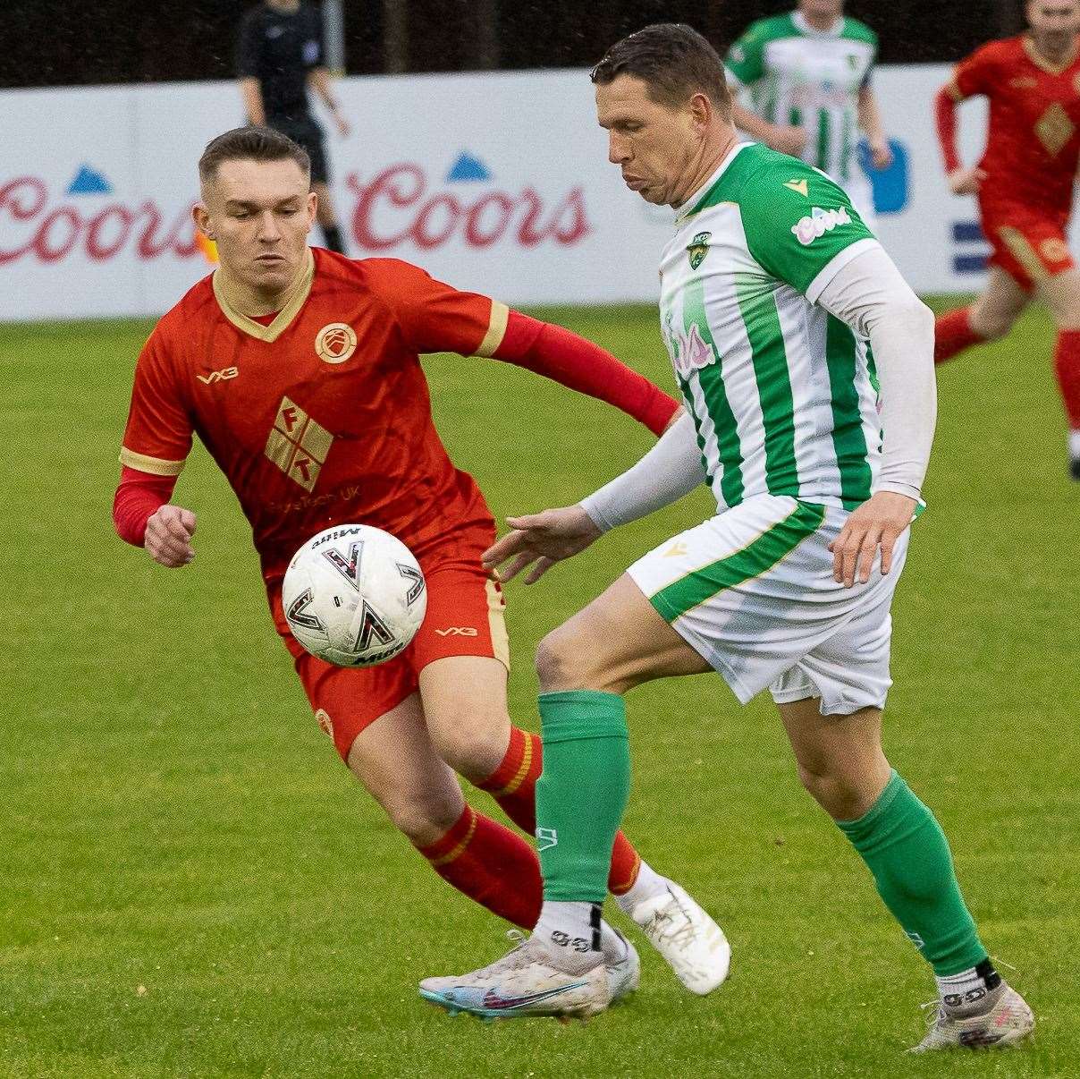 Whitstable’s in-form midfielder Josh Oliver takes on VCD man Charlie Heatley in the Oystermen’s away 2-1 Kent Senior Trophy triumph last weekend. Picture: Les Biggs