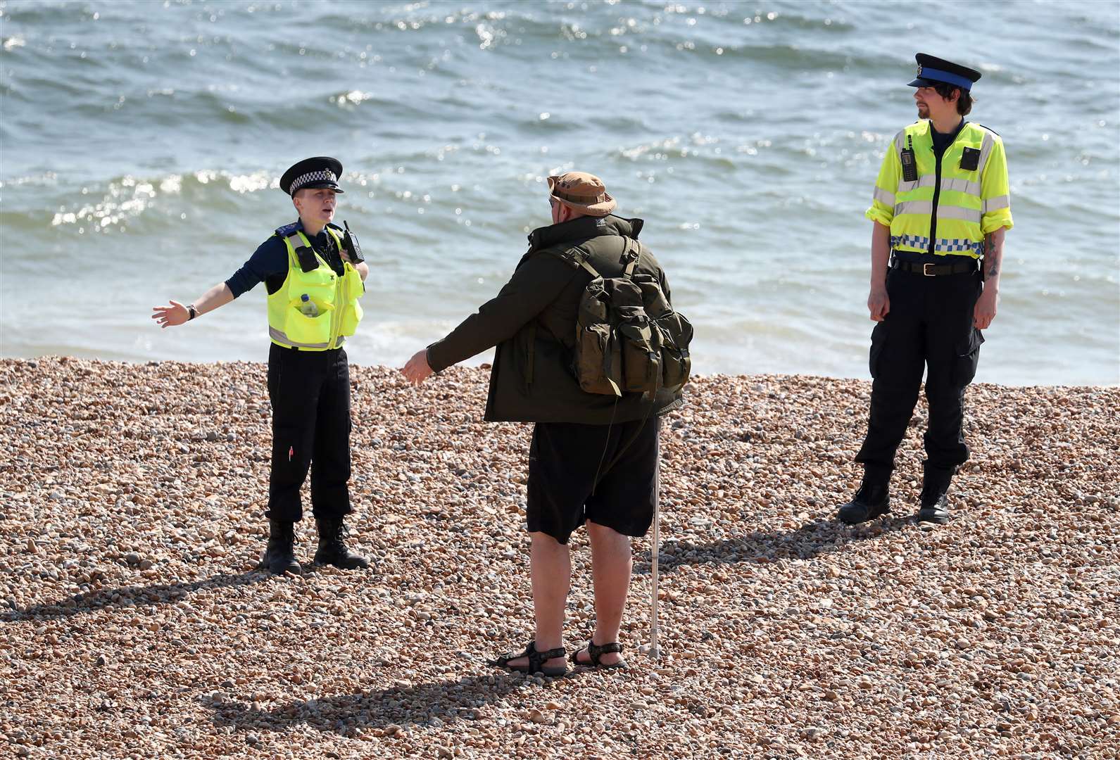 Police officers will continue to patrol public spaces such as the beach in Brighton as the UK continues its lockdown (Gareth Fuller/PA)