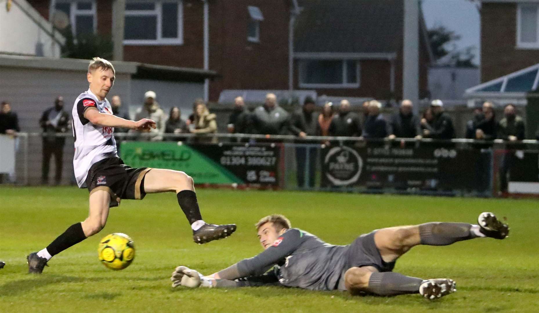 Deal's Ben Chapman is denied by Hythe keeper Joe Coleman. Picture: Paul Willmott