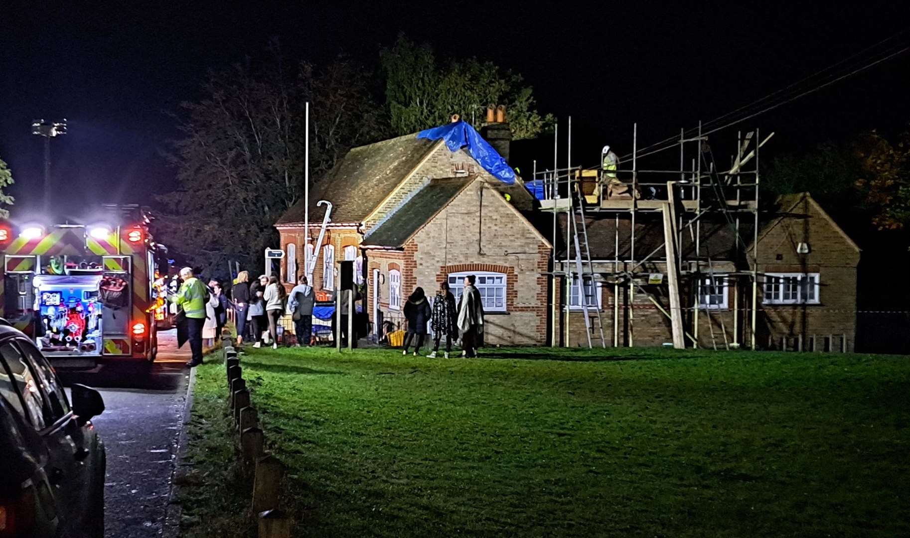 Fire crews and a group of villagers at Rodmersham primary school following the blaze