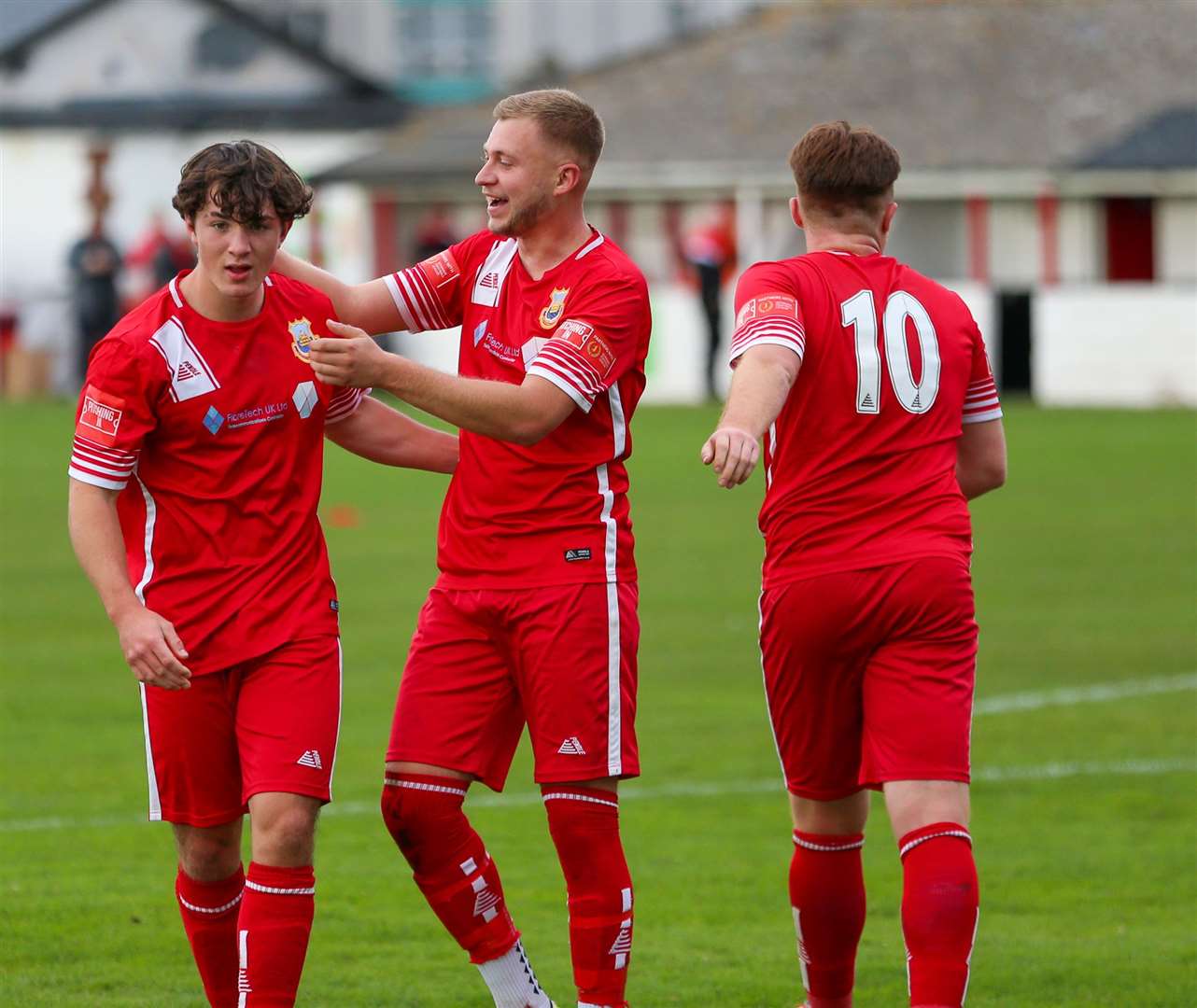 Whitstable match-winner Luke Griffiths (centre) with Gus Barnes and Tom Carlton Picture: Les Biggs